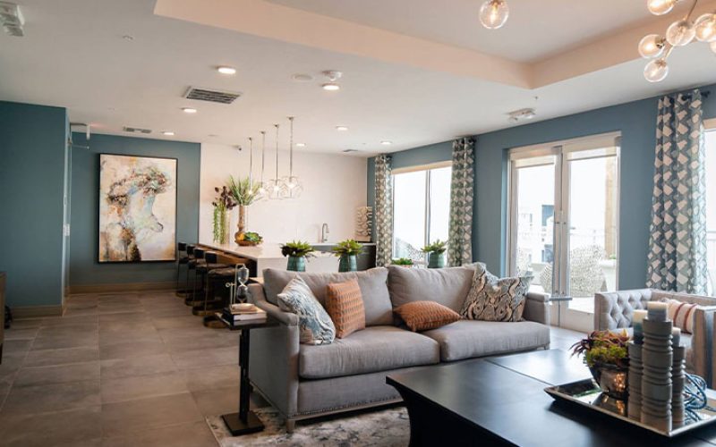 black-wooden-coffee-table-near-white-couch